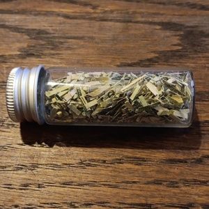 Shredded CASH Money Genuine Currency. Shreds in a glass vial.